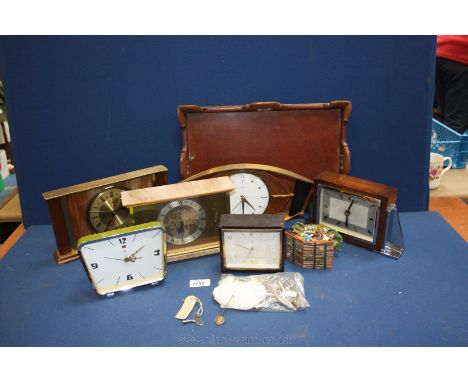 A quantity of clocks including a small cuckoo clock, a Metamec room clock, green alarm clock etc.