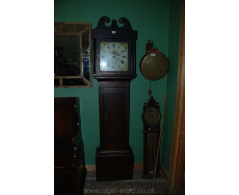 A Georgian Mahogany country longcase Clock having swan neck pediment with brass disc decoration.  The hood having turned bras