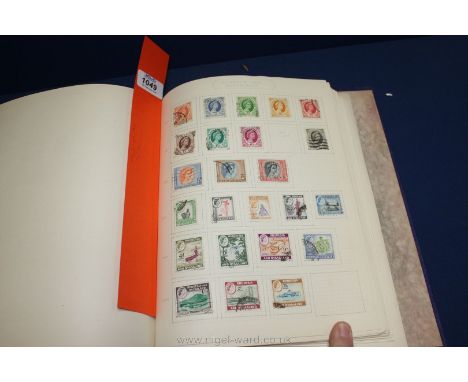 A blue Stamp Album including British Empire and Commonwealth collections, Queen Victoria to Queen Elizabeth II, particular in