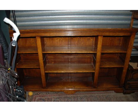 A superb quality reproduction Oak, Georgian style open Bookcase with moulded top over a wide central flight of two adjustable