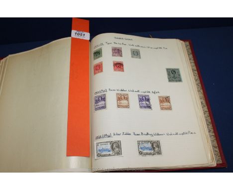 A red Sussex Stamp Album of the British Empire and Commonwealth from Queen Victoria to Queen Elizabeth II.