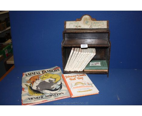 A Peter Rabbit's Book Shelf and eleven Books of the set plus two French copies, and two children's books ''Animal Families'' 