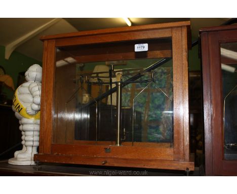 A Scientific Scales in a glass case by Baird & Tatlock, London, Ltd.