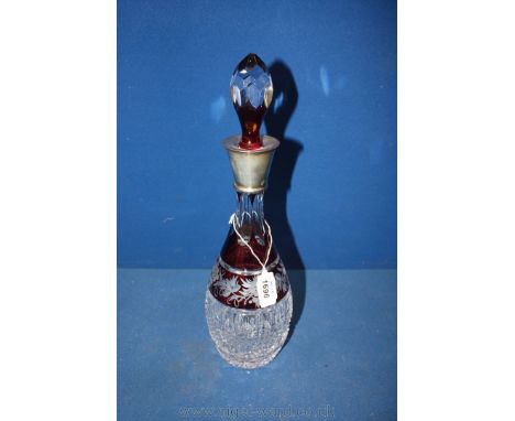 A ruby and clear glass overlaid decanter with silver collar marked Birmingham