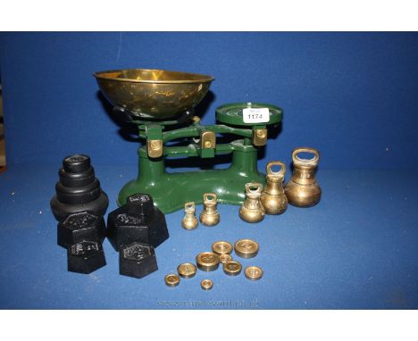 A cast iron Kitchen Scales and weights, some weights being brass.