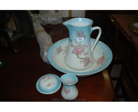 A Bedroomware Jug, basin, soap dish, etc in a pale blue and blossom design
