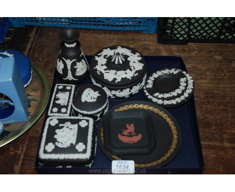 A quantity of black and white Wedgwood Jasperware Trinket Boxes, Vase, Pin Dishes, etc.
