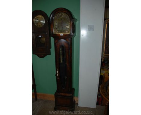 A circa 1920's Grandmother Clock, having dome topped hood with moulding, the brass face with Roman numerals, cast spandrels a