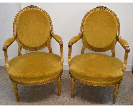 Pair of Continental armchairs with gilt show wood frames and gold oval upholstered back &amp; seat on turned fluted legs (gil