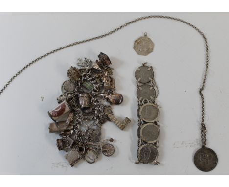 Silver and white metal charm bracelet, most charms marked, George VI India coins 1946 mounted on silver bracelet, silver St C