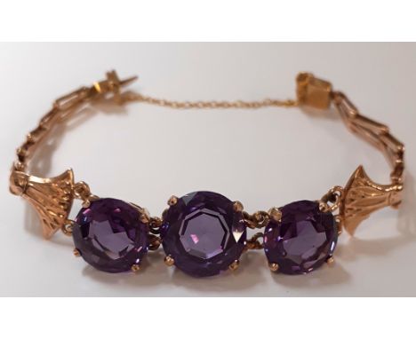 Continental tested as 9ct gold bracelet set with 3 stone synthetic alexandrite 16.3g