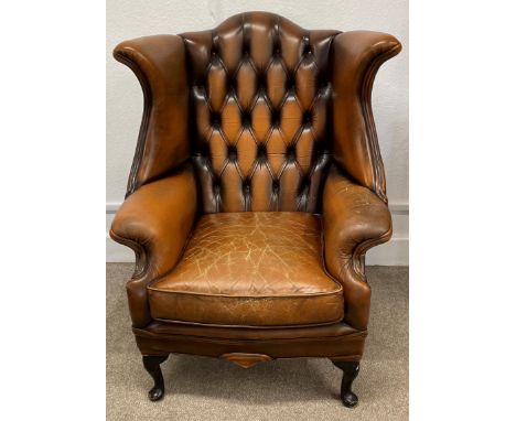 Leather button back armchair