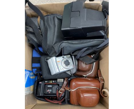 Various old cameras including a Polaroid