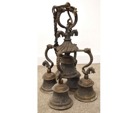 Large Tibetan bronze temple bell, configured as five bells with figural mounts and hanging chain, approx. 38cm w x 60cm tall 