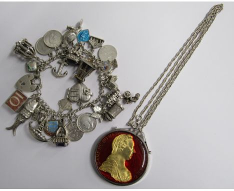 Charm bracelet with mostly silver charms, silver heart lock and white metal unmarked bracelet along with silver mounted 1780 