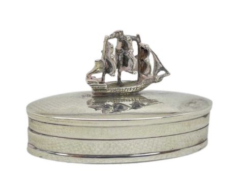 Silver Pill Pot with Ship Finial. 20 g. London 1981, Martin Gerald and Sid AdlerOf oval form with galleon finialLength 5 cmsC