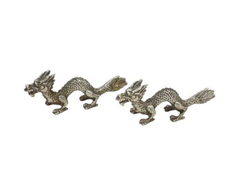 Pair of Novelty Silver Chinese Dragons. 60 g. London 1995.Well cast and full hallmarks to tail on eachLength 6.5 cmsCondition