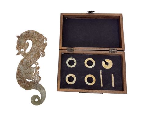 A Rare Group of Eight Archaic Calcified Jade Burial Items.in a leather box; together with an archaic style Jade Dragon plaque