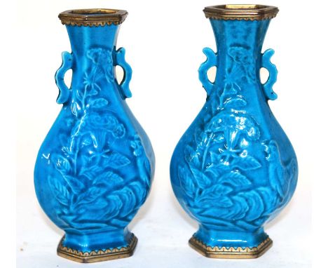A small pair of Chinese Kangxi (1662-1722) Ormolu mounted vases, each vase moulded with cockerels in a rocky setting with han