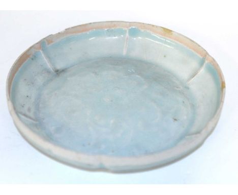 A Chinese Qingbai Dish Song Dynasty (960-1279)The shallow fluted bowl finely carved with foliate decoration, all under a ligh