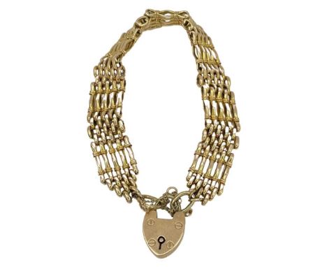 gate bracelet in 15ct gold marked on heart shape padlock charm11.5cms long Condition report: Good condition, no issues