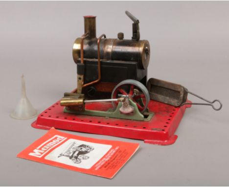 A vintage Mamod SE2a steam engine fitted with whistle and reverse lever fire box and funnel present.