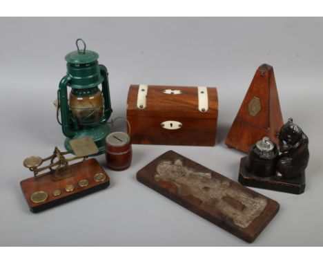 A box of collectables to include Dutch biscuit mould formed as a windmill, Black Forest inkwell, metronome, tea caddy etc.