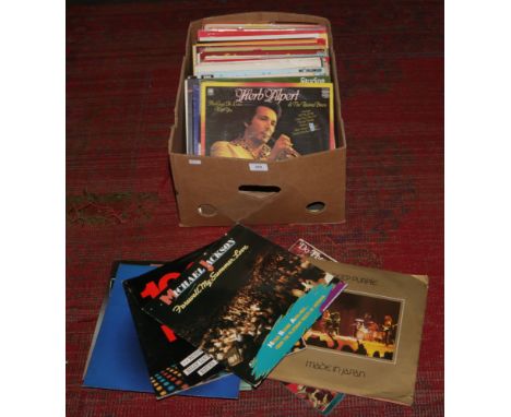 A box of L.P records to include Deep Purple, Michael Jackson, 10CC and easy listening.