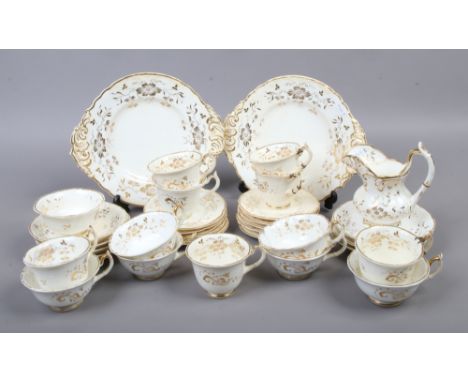 A Rockingham part tea service with gilt floral decoration puce back stamp circa 1830, 33 pieces to include cups (damaged) mil