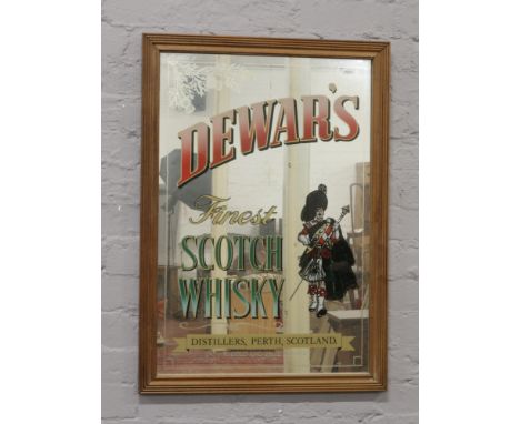 A framed Dewar's Scotch Whisky advertising mirror, 87cm x 61cm.