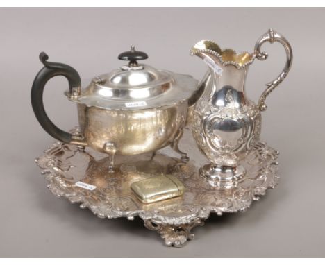 A collection of silver plate to include serving tray, Victorian jug, teapot and vesta case.