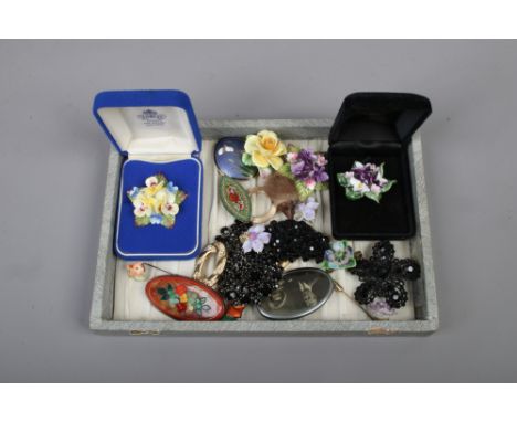 A tray of costume jewellery brooches including porcelain, enamel and micro mosaic examples.