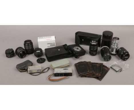 A quantity of photographic equipment including Minolta spy cameras, boxed Canon Speedlite 200E, lenses etc.