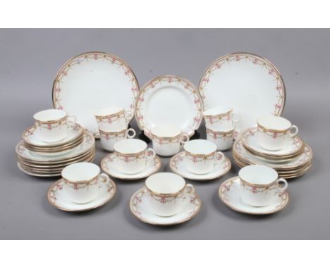 A Royal Albert Crown china 12 place tea service decorated with swags.