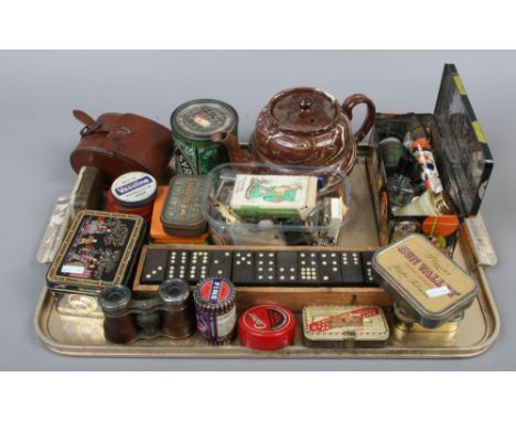 A tray of collectables including agate ware teapot, boxed dominoes, vintage tins and leather cased faux tortoise shell cloths