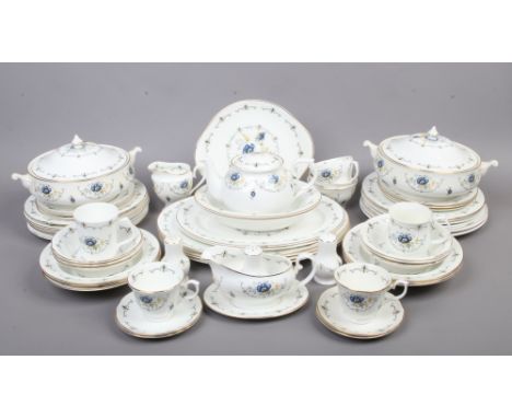 A Mayfair fine bone china dinner and tea service decorated in a blue floral design made in Staffordshire England, approximate