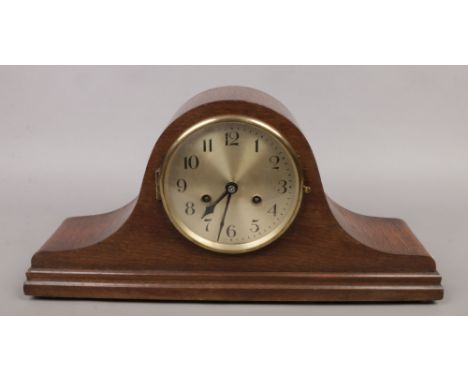 A mid 20th century oak cased 30 hour dome top mantle clock.