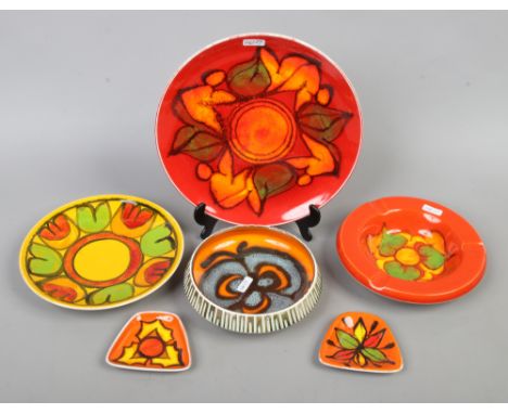 Six pieces of Poole pottery to include plate dishes etc.Condition report intended as a guide only.Bowl cracked.