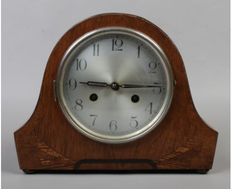 An early to mid 20th century Art Deco oak cased dome top 30 hour mantel clock.