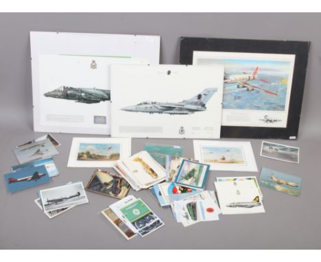A quantity of mostly aviation and war themed prints and postcards.