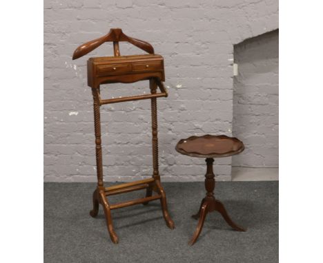 A gentleman's reproduction mahogany dressing stand along with a circular inlaid mahogany tripod wine table.