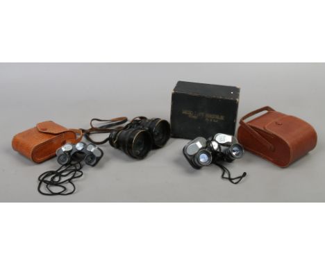 Three vintage pairs of binoculars, including boxed micro type by Zenith, a similar cased pair by Minster and a brass military