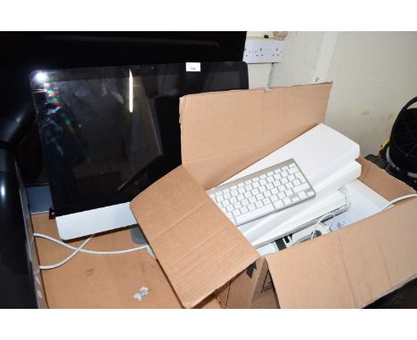 An Apple Mac computer with keyboard and accessories