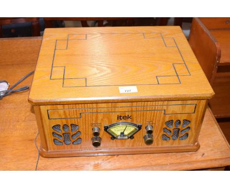 A reproduction Itek record player radio