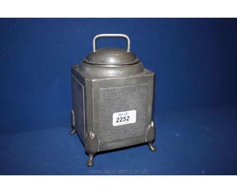 A hammered Pewter period Tea Caddy, on four feet, 8'' to top of lid.