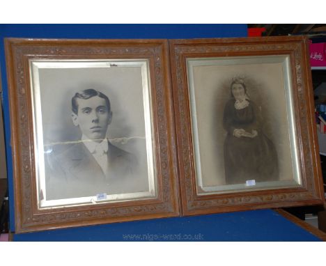 A pair of carved frames with portrait Prints under glass, 23 1/2" x 27 3/4".