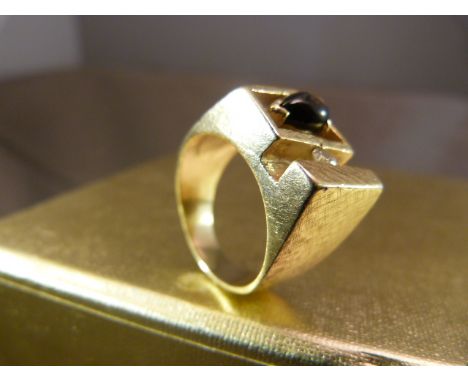 Gent's Contemporary 1970's design ring. Unmarked Gold (possibly 14K), set with an approx 10 point Brilliant cut Diamond and a