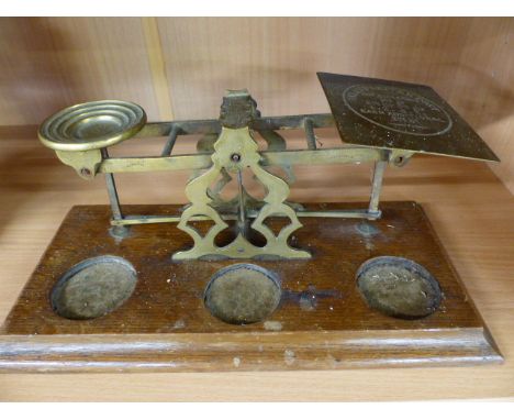 Early 20th Century brass postage scales on oak plinth - missing weights