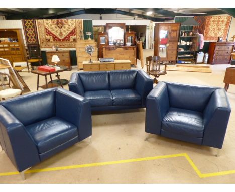 Blue leather three piece suite in the Mid Century style with chrome legs. Suite consists of two chairs and two seater sofa