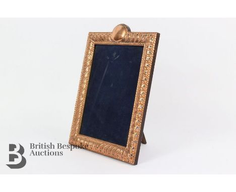 A copper easel back picture frame, heightened with blue enamel beads, approx 18.5 x 26 h cms.&nbsp;